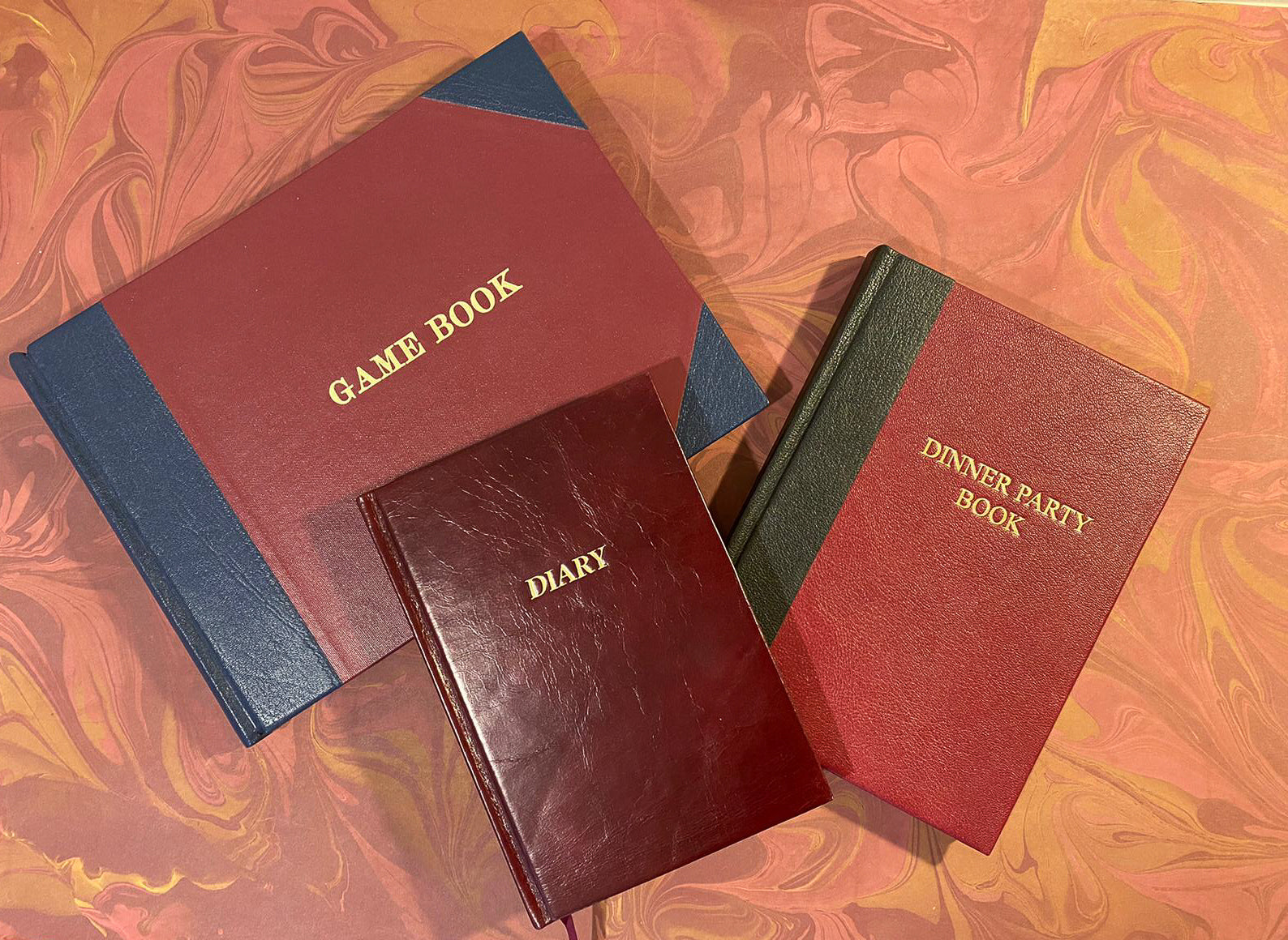 index bindery game book, diary and dinner party books on marbled paper