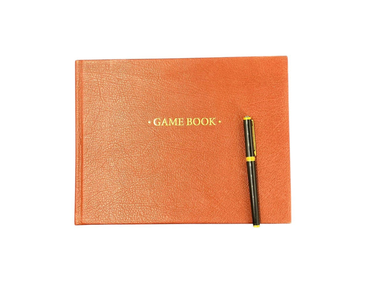 estate or game book -  personalised in orange - the index bindery